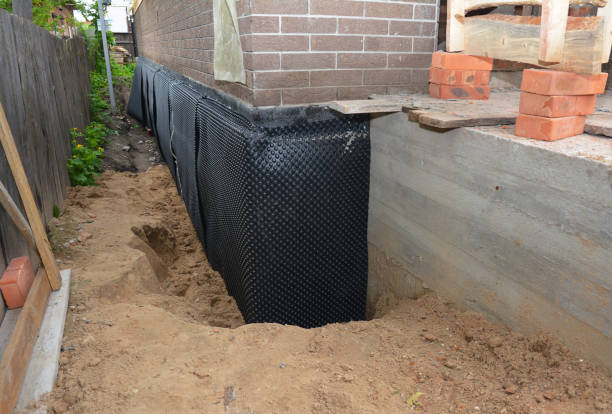 Happy homeowners after waterproofing job in Watauga